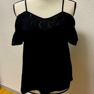 Black off the shoulder blouse. Perfect staple piece for the collection.